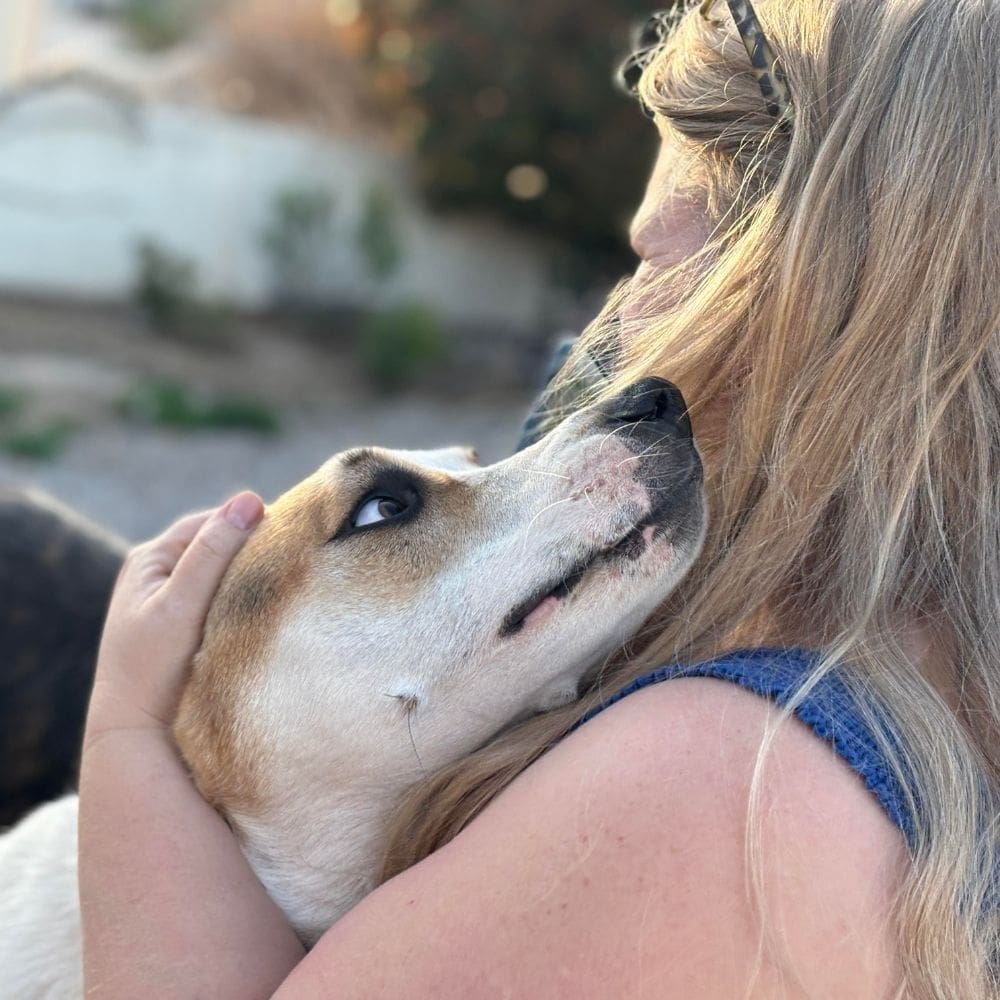 Linda | Founder of Recollections Within with her rescue puppy Frankie, symbolizing gentleness and companionship.